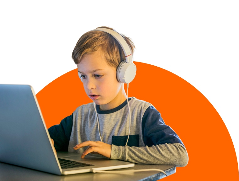 School student at his desk computer