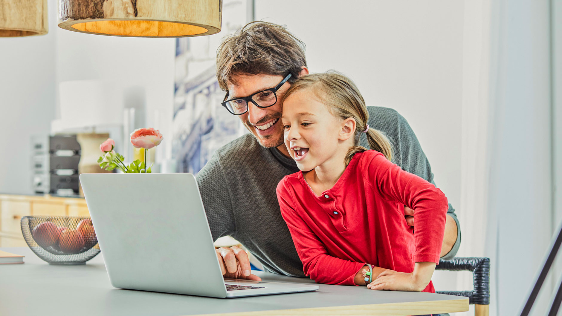 Father helping daughter with homework