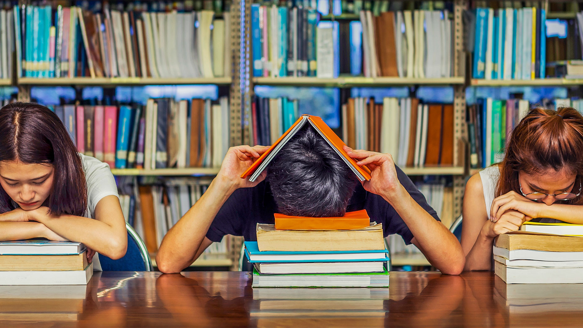 Students in library with study fatigue