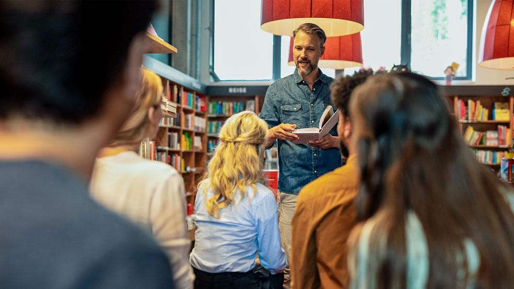 teacher explaining to a class how to analyse characters in English text